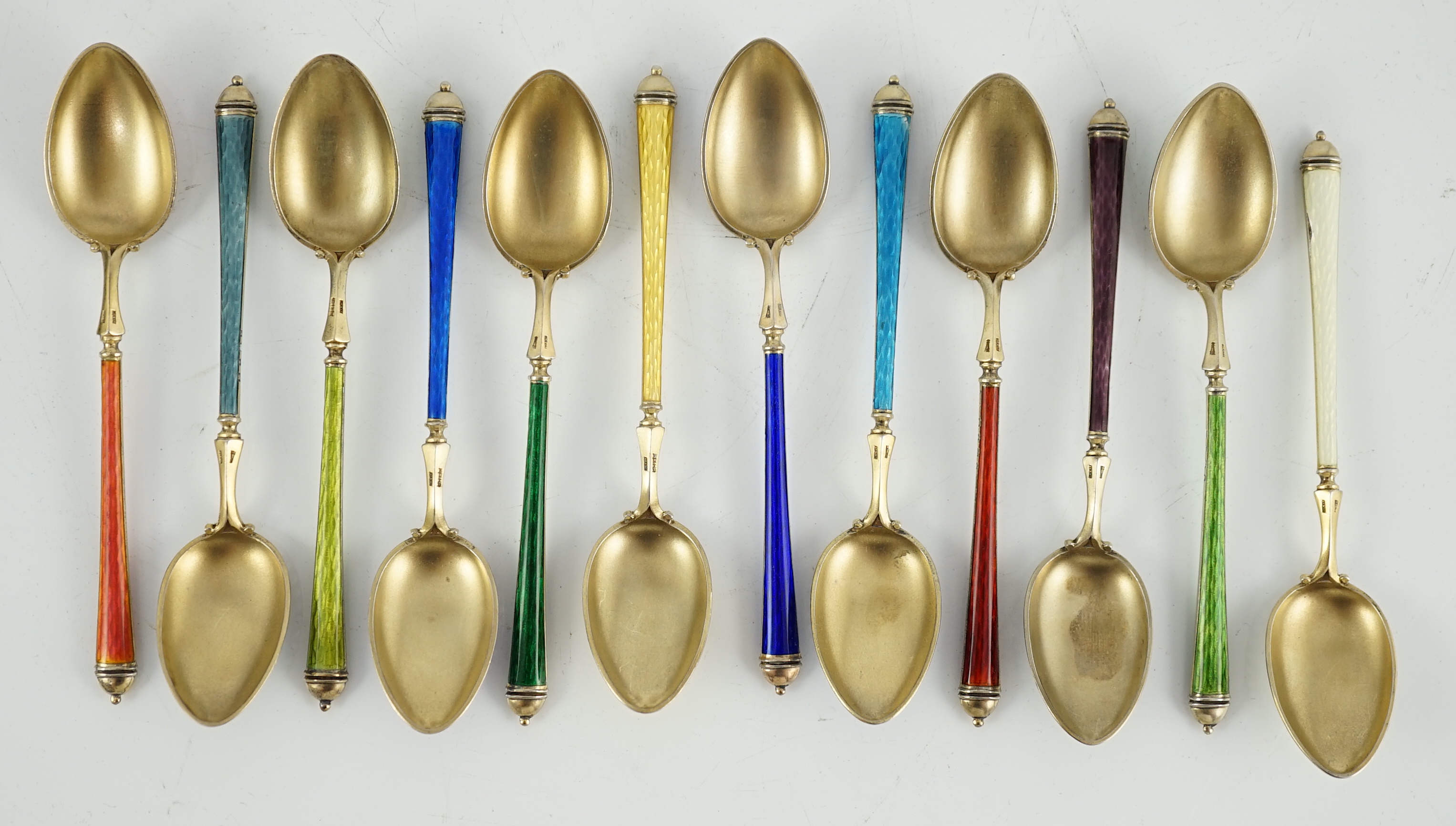 A cased set of twelve Norwegian silver gilt and polychrome enamel coffee spoons, retailed by Tiffany & Co